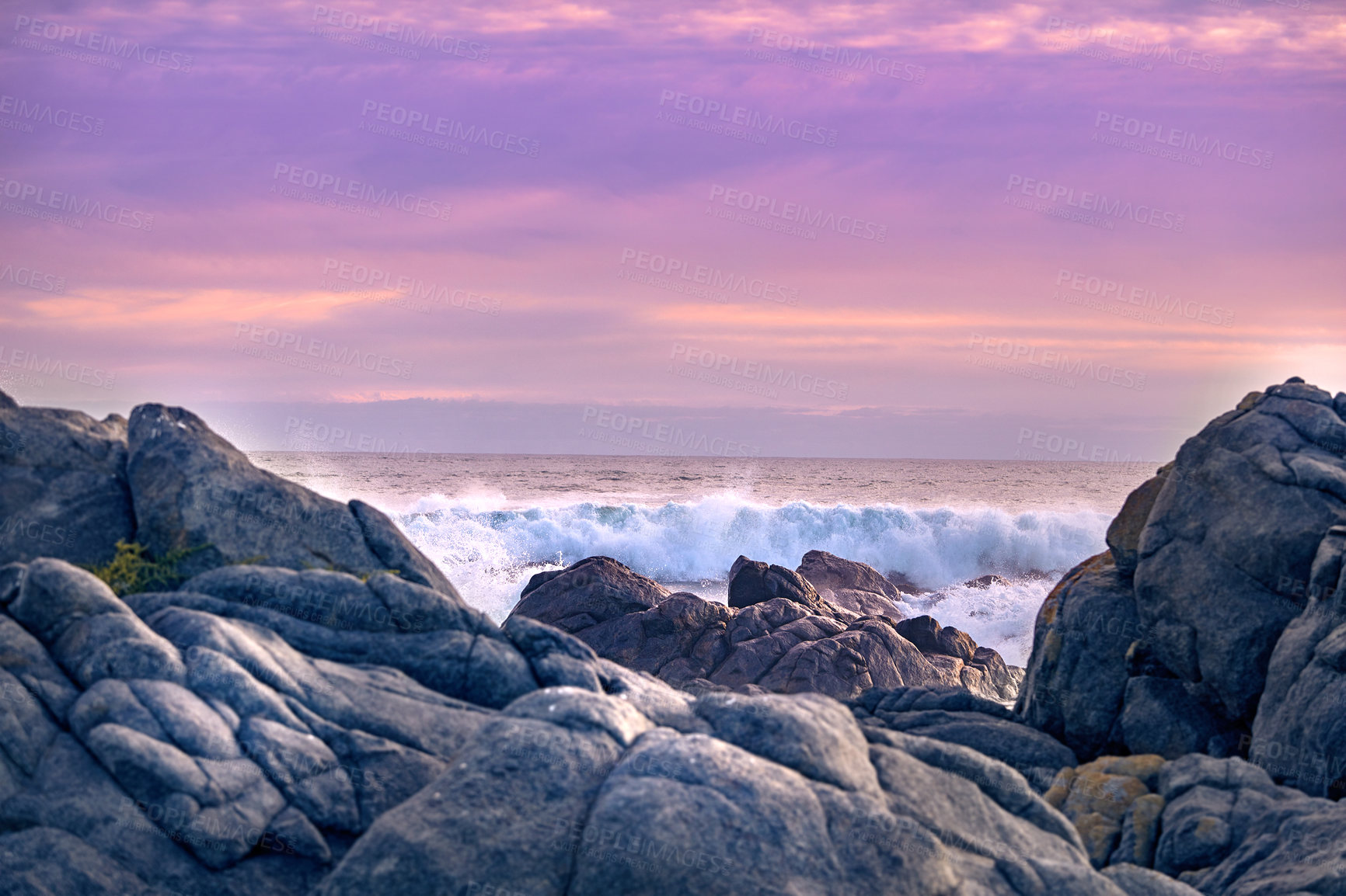 Buy stock photo Rocks, seascape and waves at sea for wallpaper, splash and travel in nature with sunset sky. Ocean, boulders and geology in environment for ecosystem, horizon and landscape in evening in California