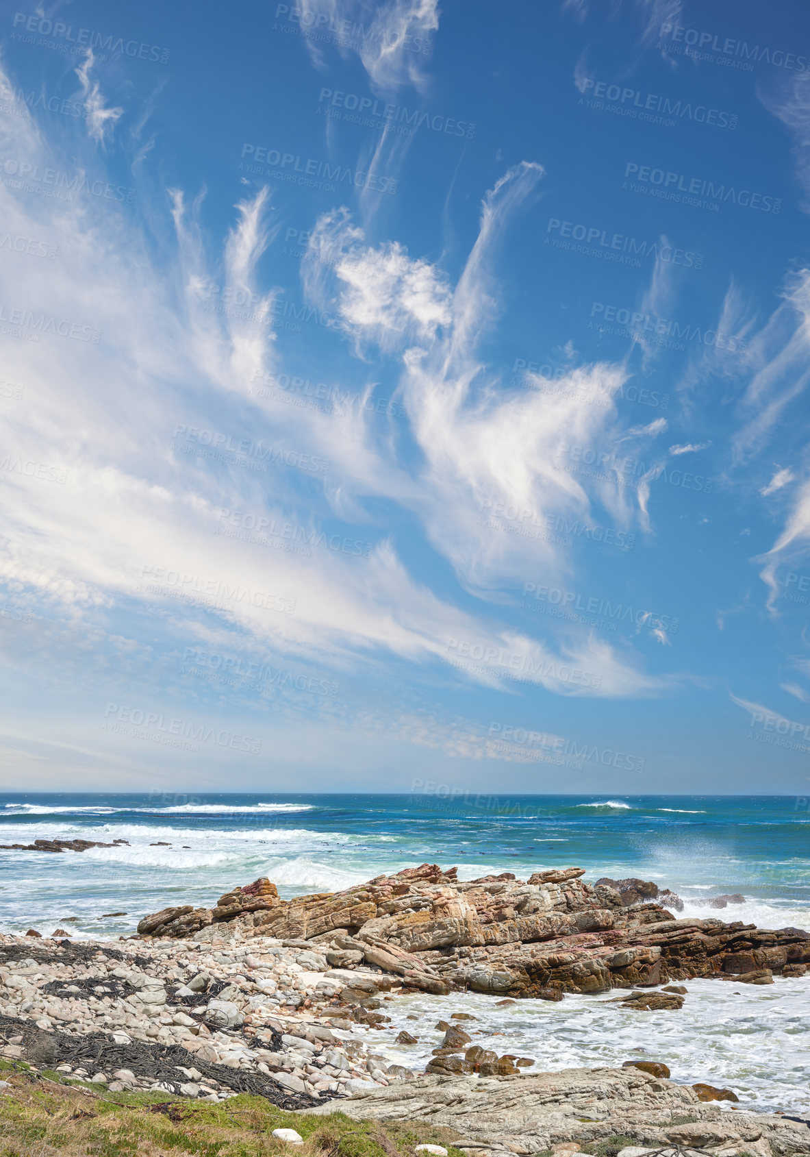 Buy stock photo Outdoor, coast and ocean with rocks, waves and destination for travel location at sea in Indonesia. Island tourism, outside and beach with scenic nature, clouds or rock erosion for climate change