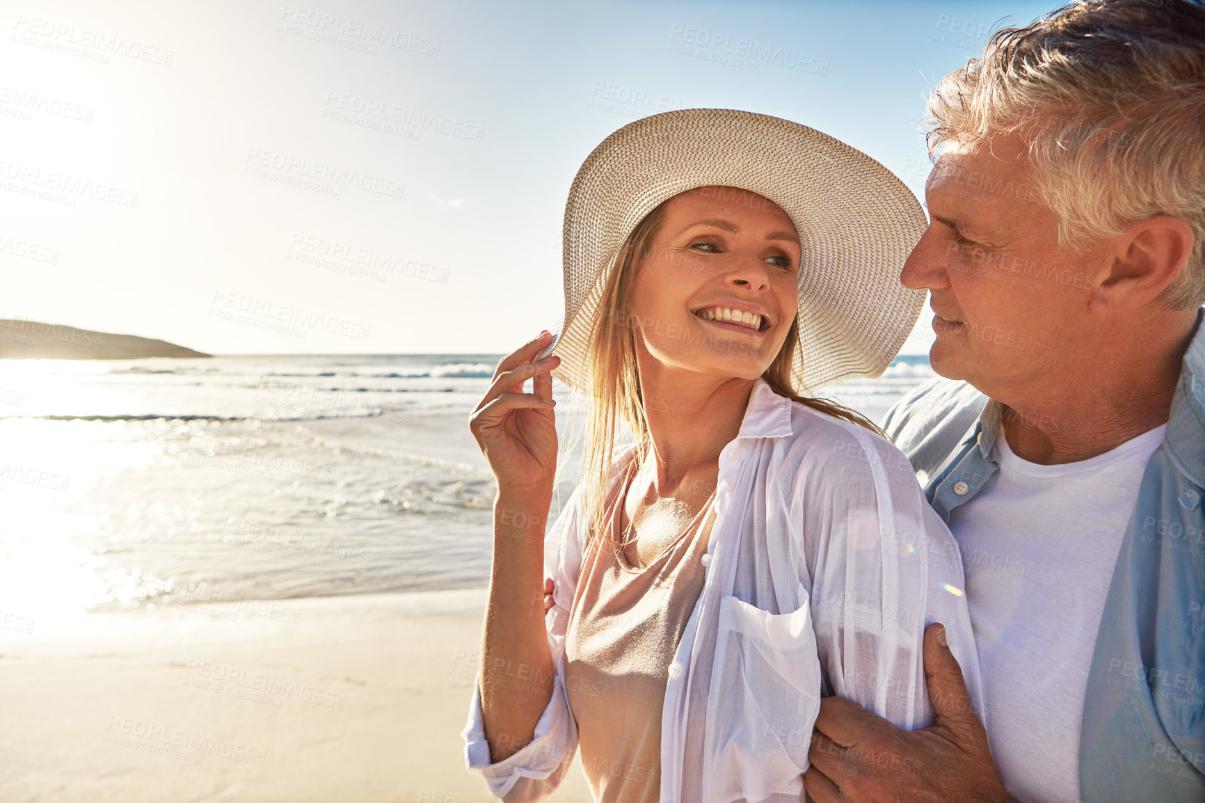 Buy stock photo Shot of a mature couple spending the day at the beach
