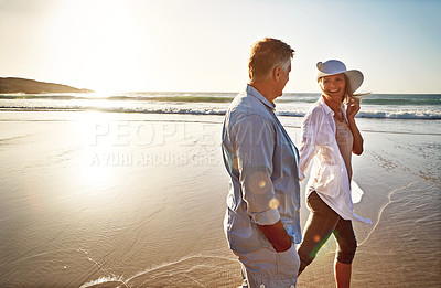 Buy stock photo Happy couple, walk and holding hands on beach for holiday on island or coast for getaway, travel and vacation. Woman, man and relationship for love or marriage anniversary by ocean at sunrise in Bali