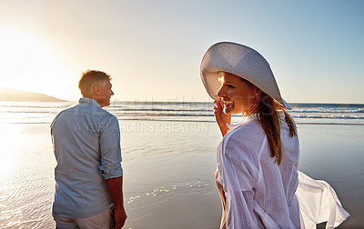 Buy stock photo Shot of a mature couple spending the day at the beach