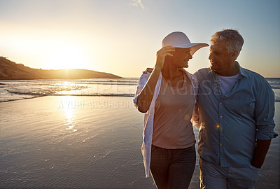 Buy stock photo Shot of a mature couple spending the day at the beach