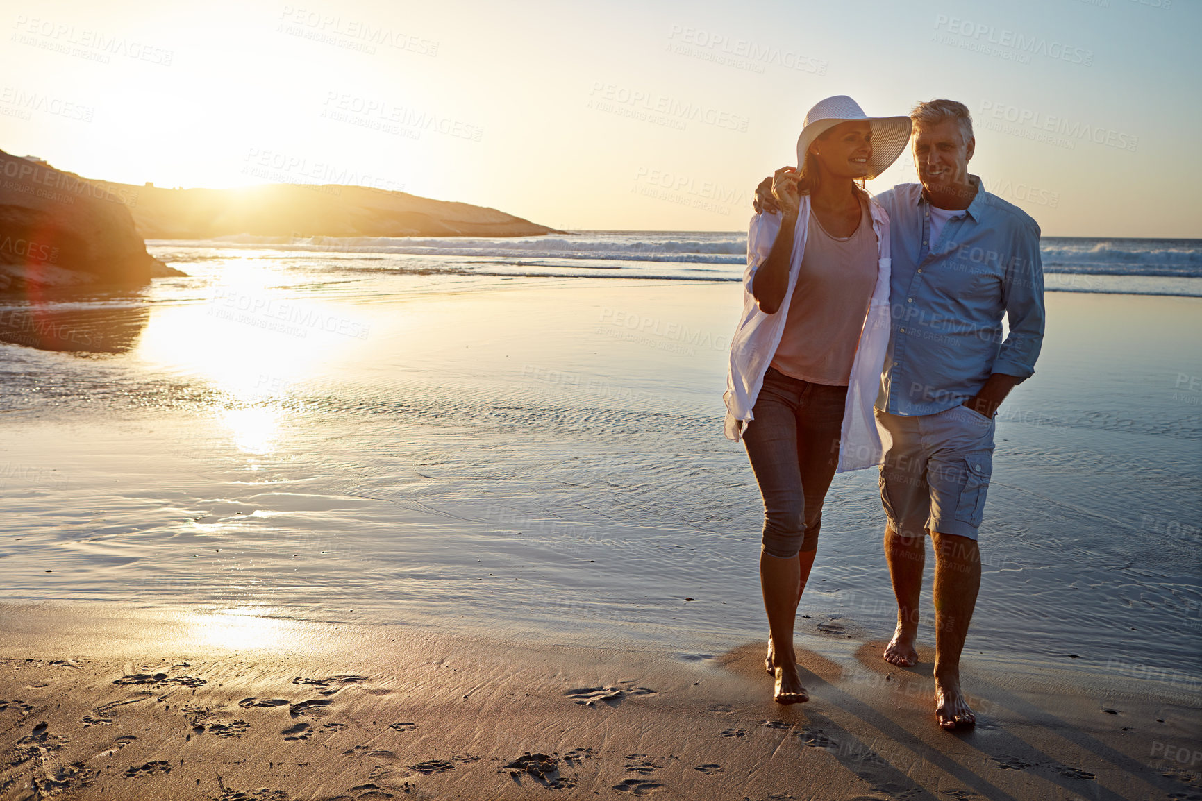 Buy stock photo Happy couple, hug and bonding on beach for vacation on island or coast for getaway, travel and holiday in Indonesia. Woman, man and relationship for love or marriage anniversary by ocean at sunset