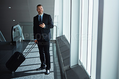 Buy stock photo Business man, phone and suitcase in airport hallway with smile, thinking or idea for international travel. Entrepreneur, luggage and smartphone with flight schedule for global immigration in London