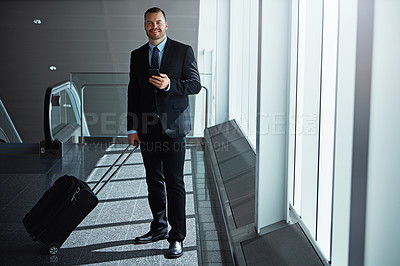 Buy stock photo Smile, portrait or businessman in airport with phone, luggage or suitcase in waiting room to travel. Social media, happy entrepreneur or corporate worker texting on mobile app on international flight