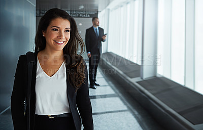 Buy stock photo Walking, thinking or happy woman in airport for business trip with smile for a booking or commute. Opportunity, pride or corporate worker in hall for holiday travel or journey on international flight