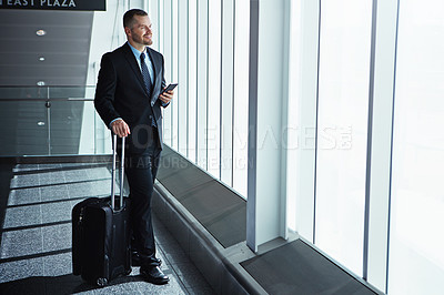 Buy stock photo Business man, phone and airport window with suitcase for smile, thinking and idea for international travel. Entrepreneur, luggage and smartphone with flight schedule for global immigration in London