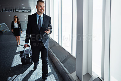 Buy stock photo Business man, woman and phone in airport hallway with smile, thinking or suitcase for international travel. Entrepreneur, luggage and smartphone with flight schedule for global immigration in London