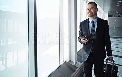 Buy stock photo Business man, smartphone and window in airport hallway with smile, thinking and vision on international travel. Entrepreneur, luggage and phone with flight schedule for global immigration in London