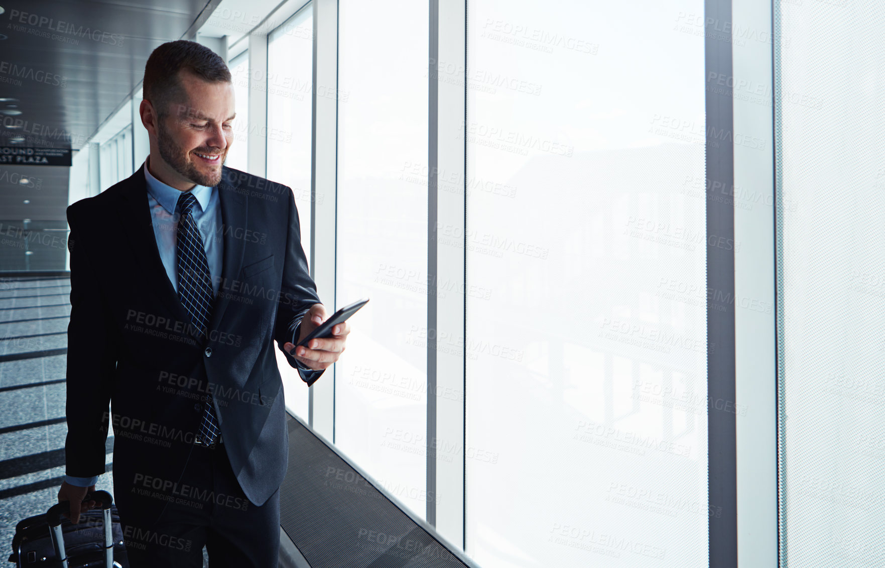 Buy stock photo Corporate man, phone and window in airport corridor for reading, thinking or communication on business travel. Entrepreneur, luggage and smartphone for flight schedule or global immigration in London