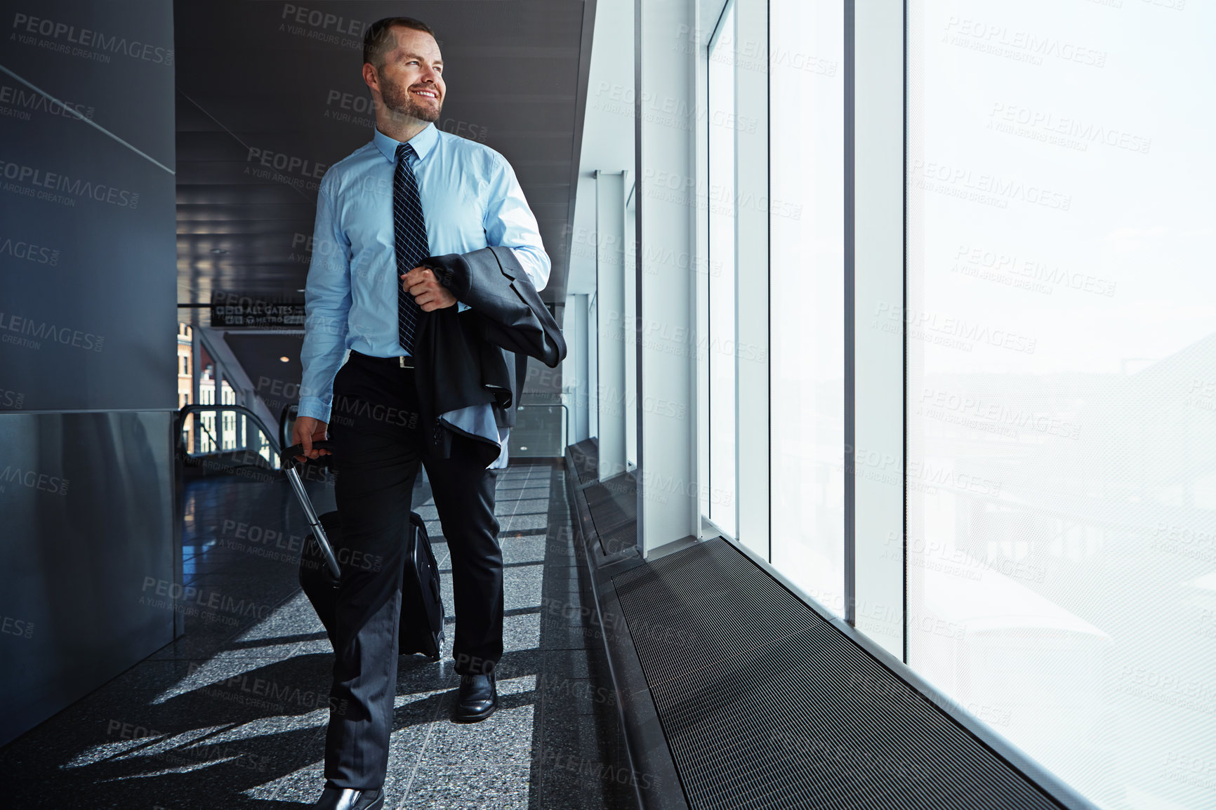 Buy stock photo Walking, flight or business man in airport thinking of company trip with suitcase or luggage for commute. Happy, window or corporate worker in hallway for journey or international travel with pride