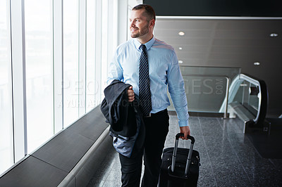 Buy stock photo Walking, smile or manager in airport thinking of company trip with suitcase or luggage for commute. Happy businessman, idea or corporate worker in hall for journey or international travel by window