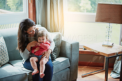 Buy stock photo Mother, child and happy on couch in home with relax, bonding and love with embrace for fun together. Family, woman and daughter or kid with smile for trust, care and security in living room of house