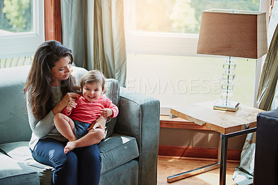 Buy stock photo Relax, happy and smile with mother and baby on sofa for bonding, quality time and child development. Growth, support and trust with mom and daughter in family home for health, connection and care
