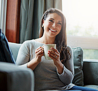 Buy stock photo Coffee, thinking and relax with a woman in her home, sitting on a sofa in the living room feeling happy. Idea, tea and lifestyle with an attractive young female relaxing on a couch in her lounge