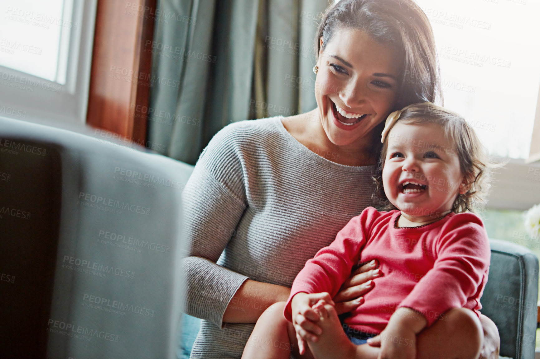 Buy stock photo Mom, toddler and relax with laughing on sofa in home living room with care, love and bonding together. Girl, mother and daughter with funny memory on couch with smile for connection in family house