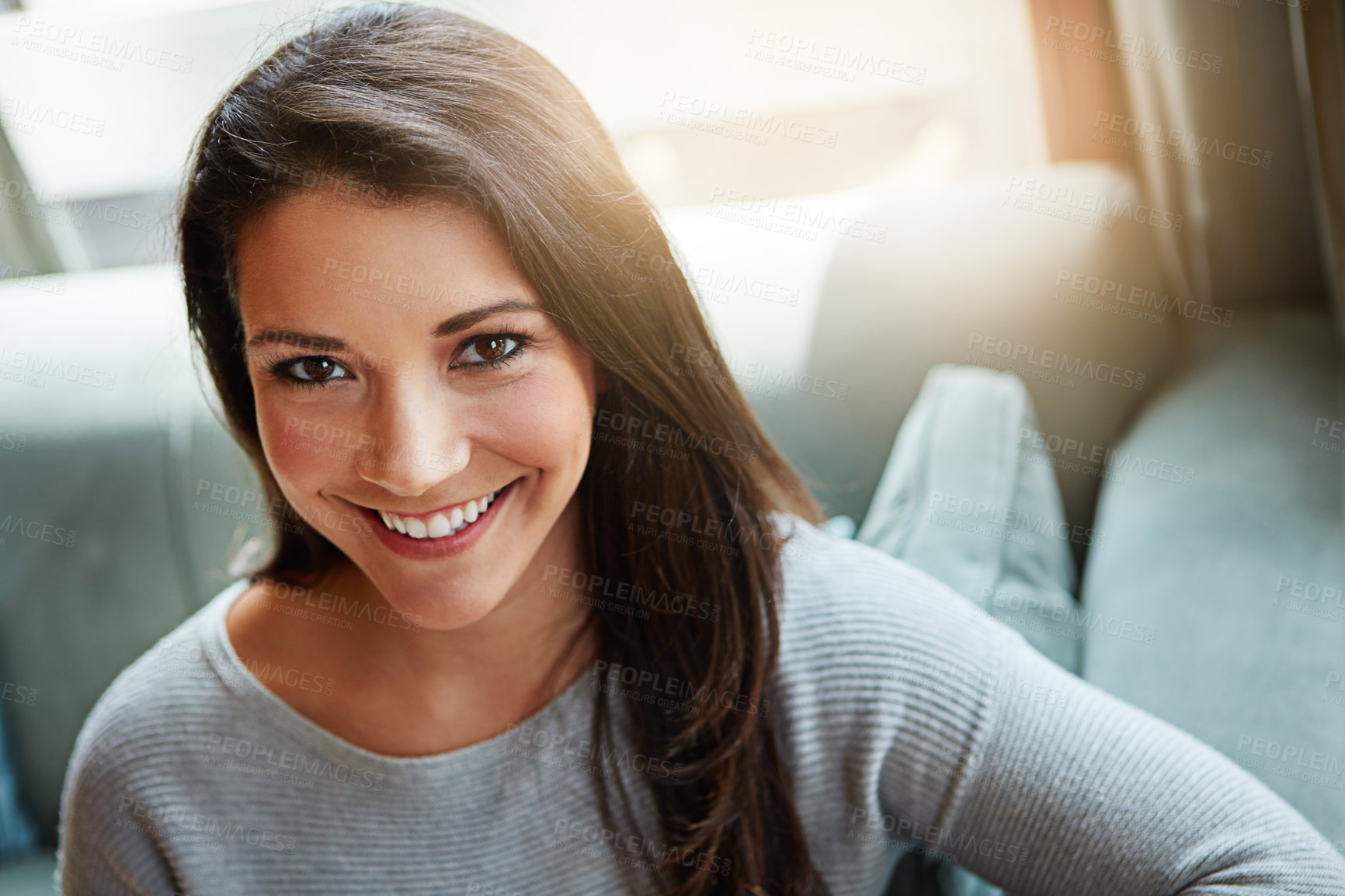 Buy stock photo Portrait of an attractive young woman relaxing at home