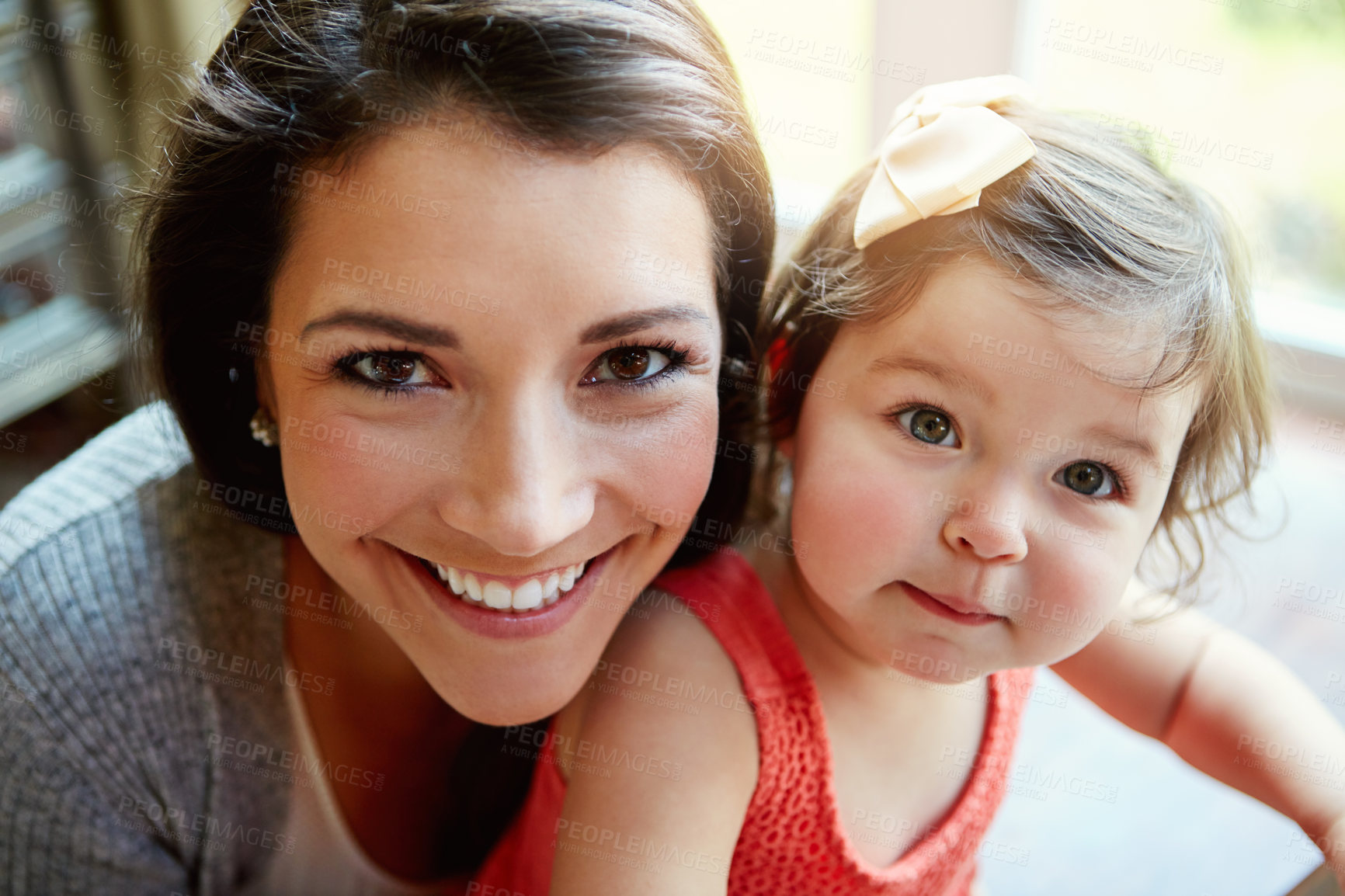 Buy stock photo Portrait, mother and girl with smile, happiness and bonding in living room, weekend and relax together. Motherhood, mama and daughter in lounge, cheerful and positive with care, loving and family