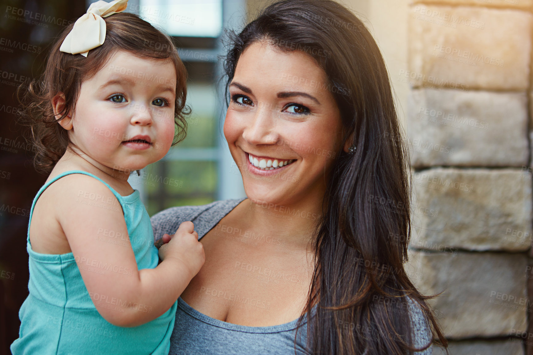 Buy stock photo Outdoor, portrait and woman with baby by house for summer fun, care and support in child development. Family, toddler girl and mom with smile at home for bonding, growth and motherhood on weekend