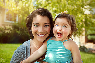 Buy stock photo Portrait of a mother bonding with her adorable little daughter outside