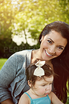 Buy stock photo Portrait of a mother bonding with her adorable little daughter outside