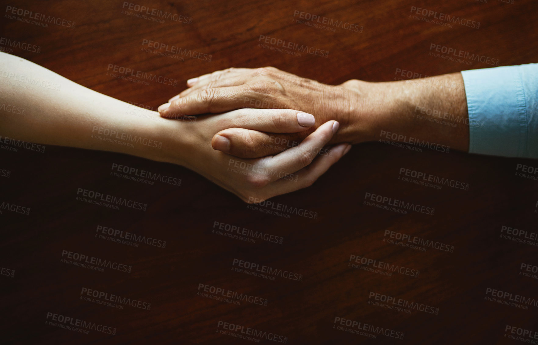 Buy stock photo Empathy, support and trust with people holding hands together from above for comfort, emotion or love. Anxiety, depression or mental health with friends in prayer at table for grief, loss or pain