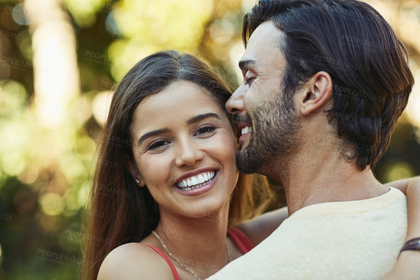 Buy stock photo Outdoor, couple and hug with laughing in park for bonding, love and affection in Spain. People, relationship and happy for support with care as lovers on break to relax, rest and embrace for date