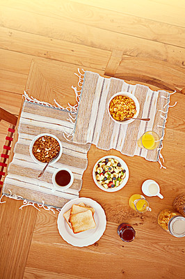 Buy stock photo High angle shot of an empty table set with breakfast foods