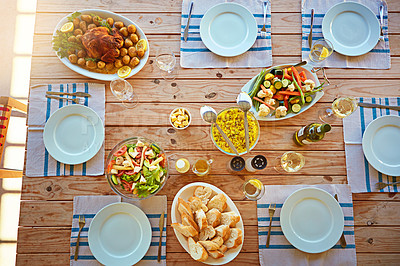 Buy stock photo High angle shot of a lunch table laid out with delicious food