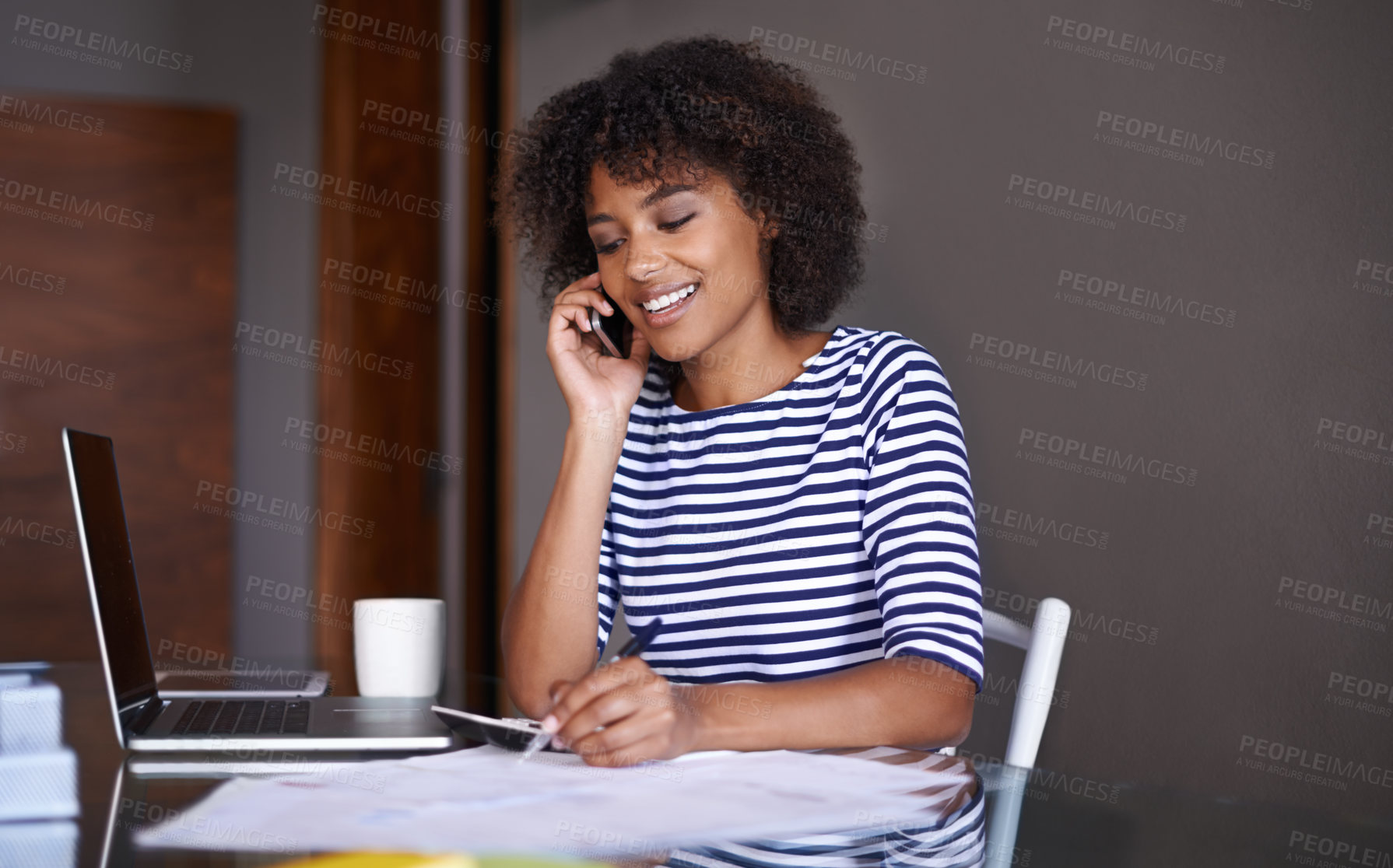 Buy stock photo Cropped shot of an attractive young woman working at home