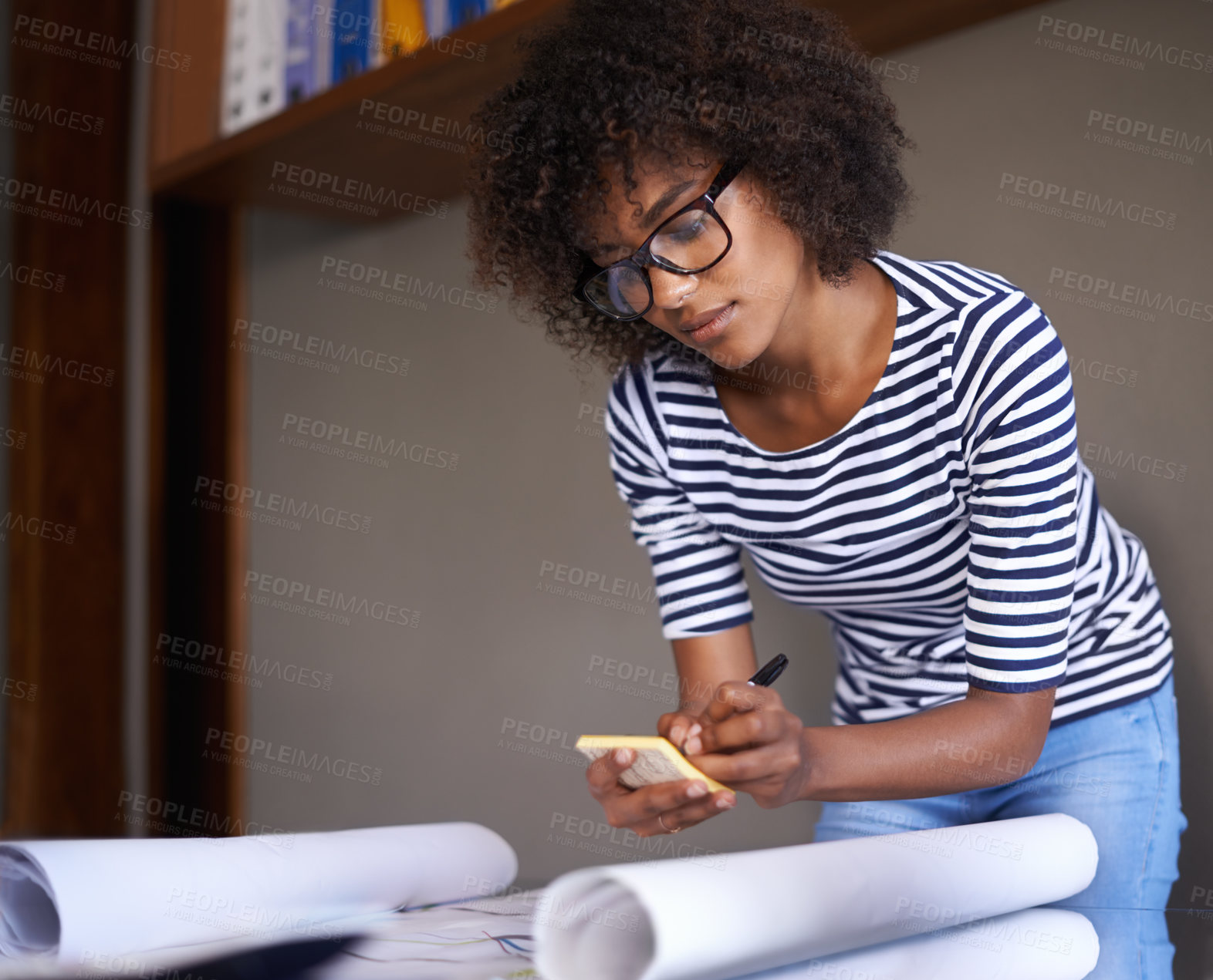 Buy stock photo Woman, home and writing on notepad with plans, business and remote work from living room. Strategy, architect and African female person serious and concentrated for architecture by black worker