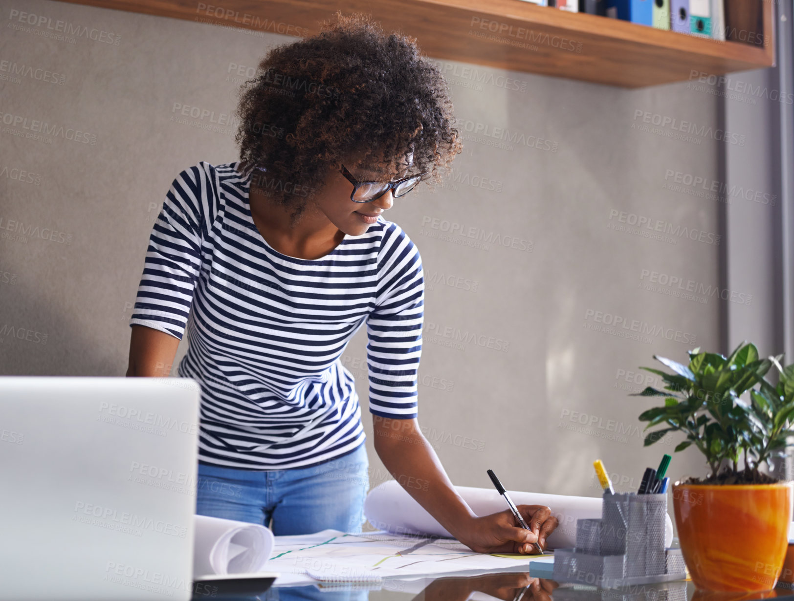 Buy stock photo Cropped shot of an attractive young woman working at home