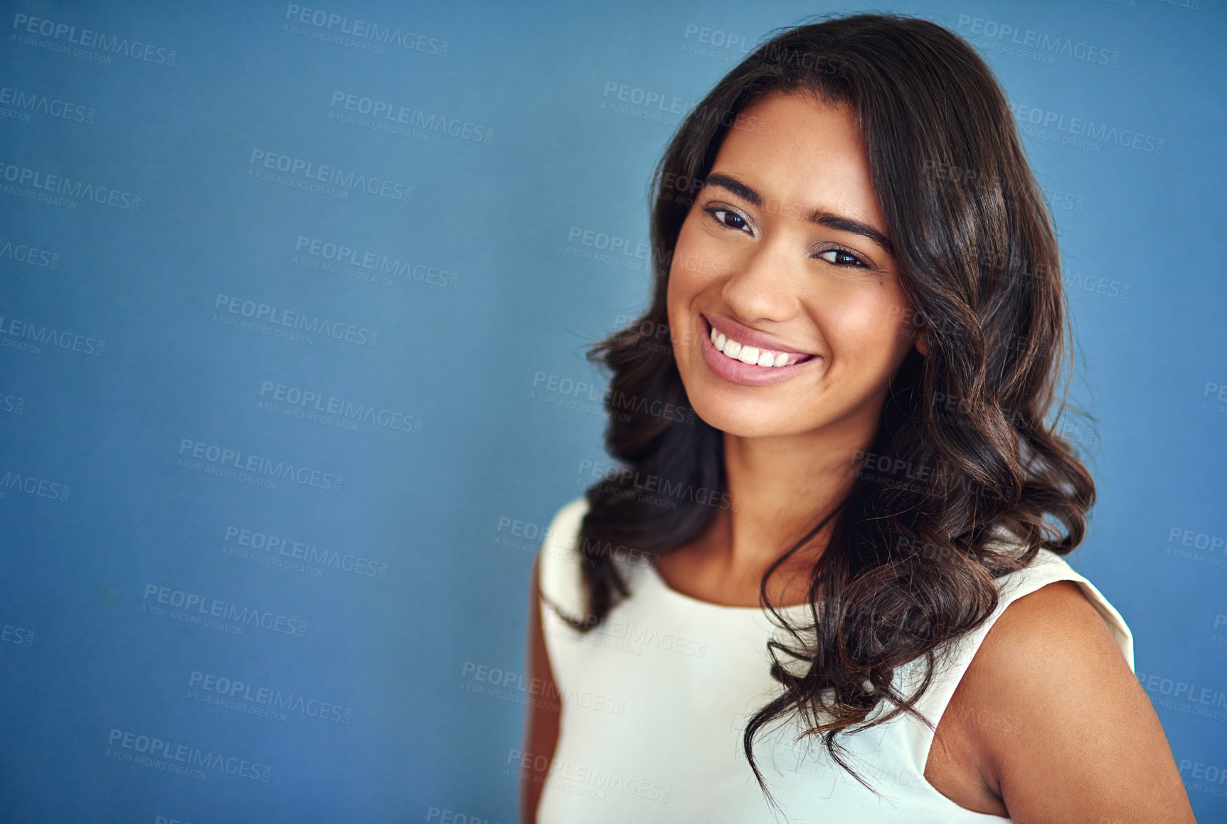 Buy stock photo Studio, portrait and business woman with mockup for profession, job and corporate worker with smile. Female employee, ambitious and positive for administration, career and space by blue background