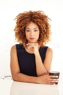 Buy stock photo Studio portrait of an attractive young businesswoman sitting at her desk