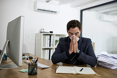 Buy stock photo Cropped shot of a businessman suffering with allergies in an office