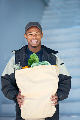 Buy stock photo Portrait of a courier making a grocery delivery