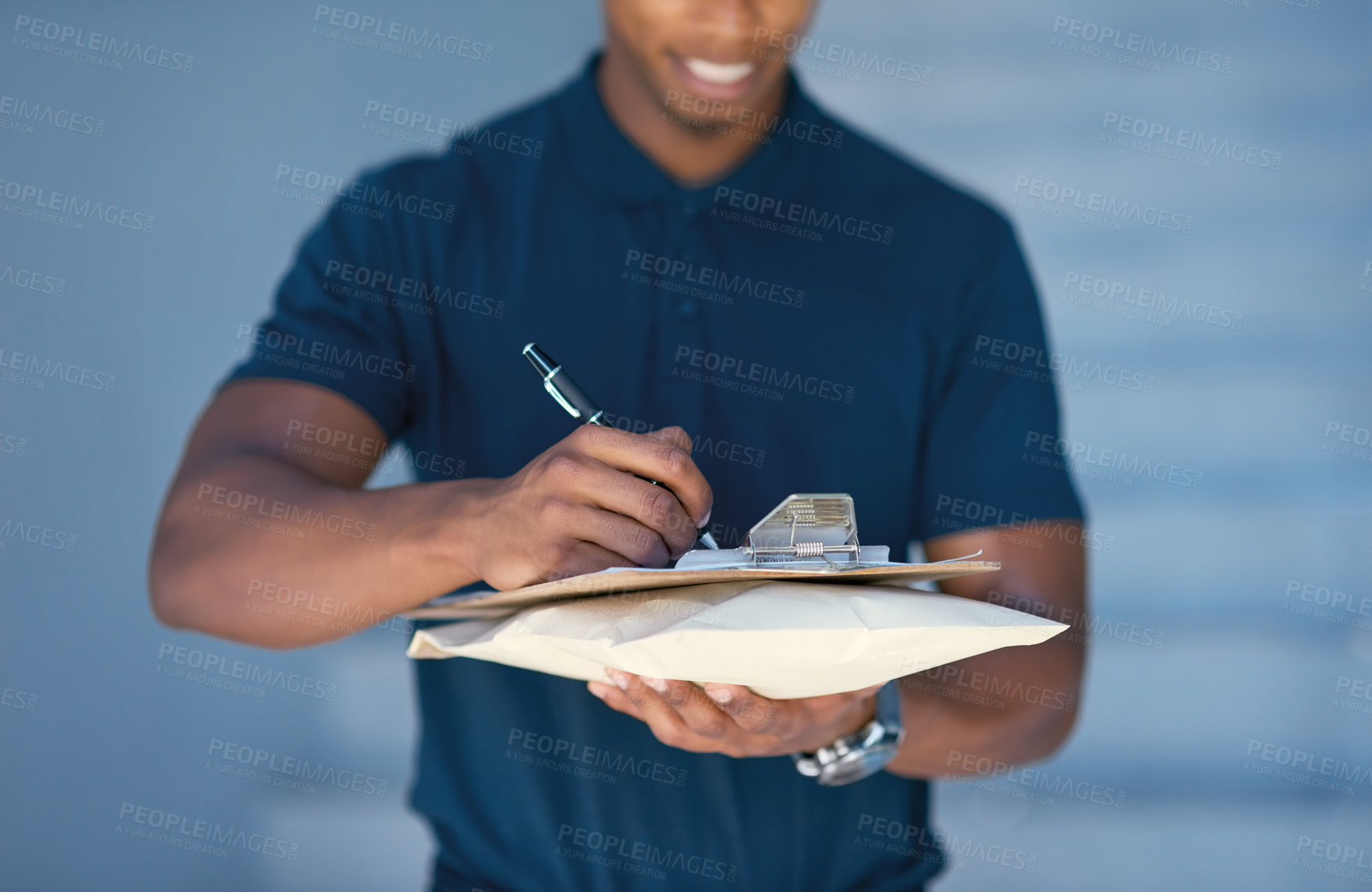 Buy stock photo Cropped shot of an unidentifiable courier filling in paperwork while out on a delivery