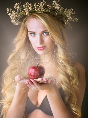 Buy stock photo Portrait, flower wreath and woman with red apple in studio isolated on black background. Face, food and girl with forbidden fruit for magic fantasy, temptation and sin of model in crown with makeup