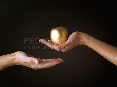 Buy stock photo Gold, fruit and hand of people in studio with forbidden apple, giving and temptation of sin. Art, creative and Christian with colorful food for faith, spiritual and religion on black background