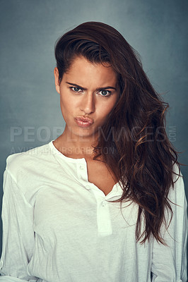 Buy stock photo Funny face, comedy and portrait of woman, silly and confident by backdrop, hair and casual fashion. Happy female person, beauty and emoji or goofy, care and joke or pose, pout and crazy or kiss