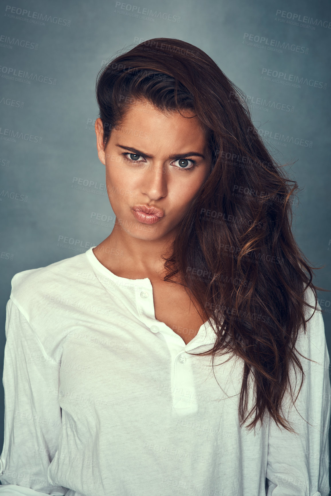 Buy stock photo Funny face, comedy and portrait of woman, silly and confident by backdrop, hair and casual fashion. Happy female person, beauty and emoji or goofy, care and joke or pose, pout and crazy or kiss