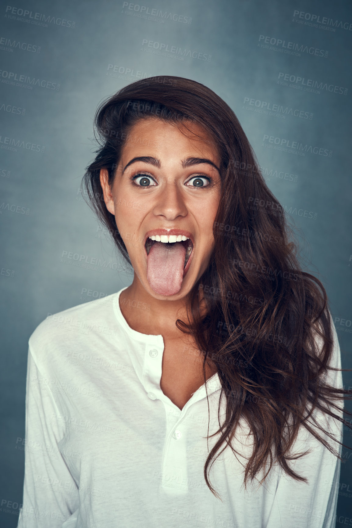 Buy stock photo Girl, portrait and tongue out for fashion in studio background for style, trendy and outfit in gray backdrop. Female person, gen z and excited expression in positive, cosmetic with pride or confident