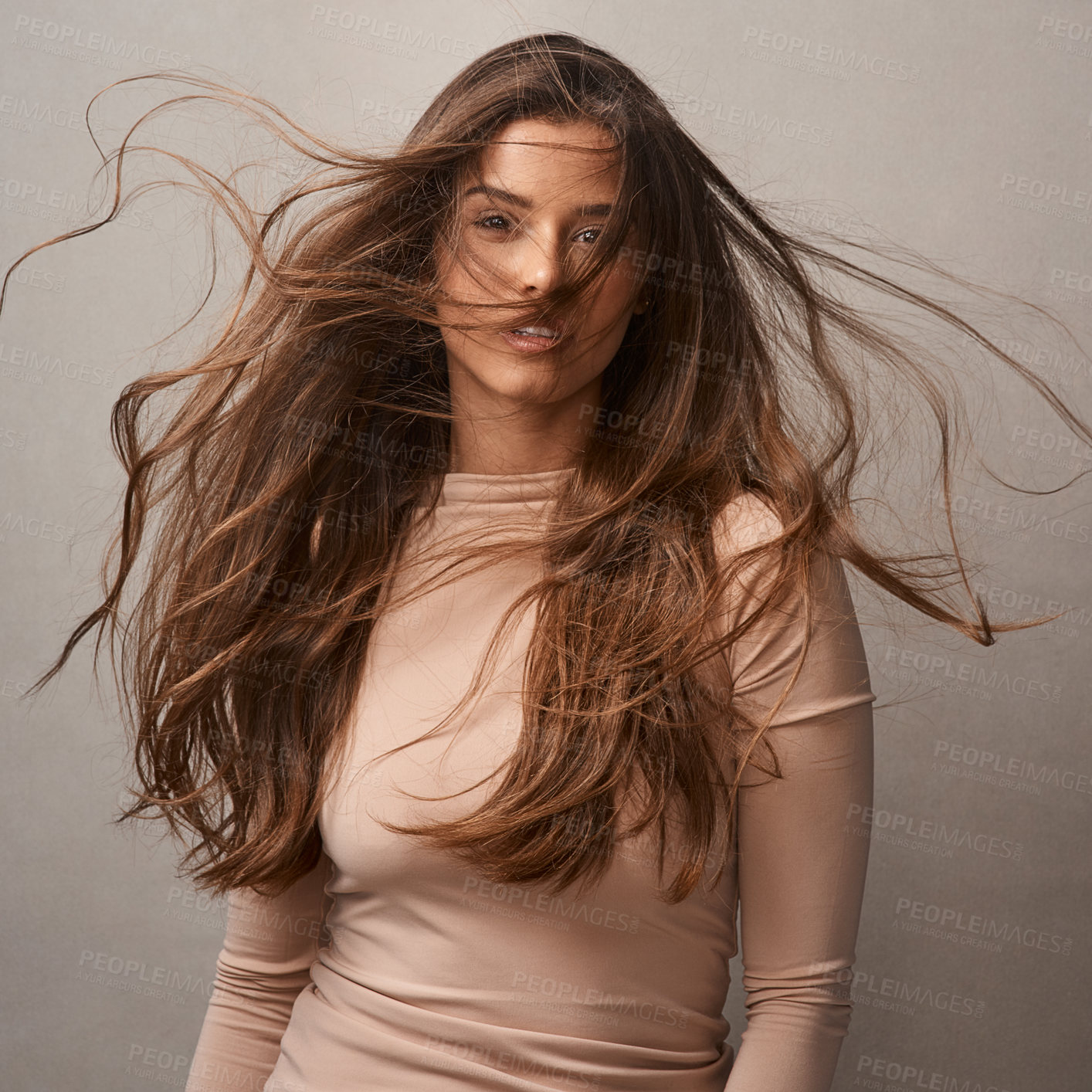 Buy stock photo Wind, hair care and portrait of girl for natural growth, cosmetics results and confidence in studio. Flow, breeze and face of proud model woman on grey background for conditioner, texture and beauty