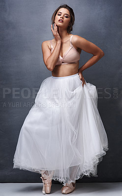 Buy stock photo Portrait of a beautiful young woman posing in studio while wearing a bra and ballet skirt
