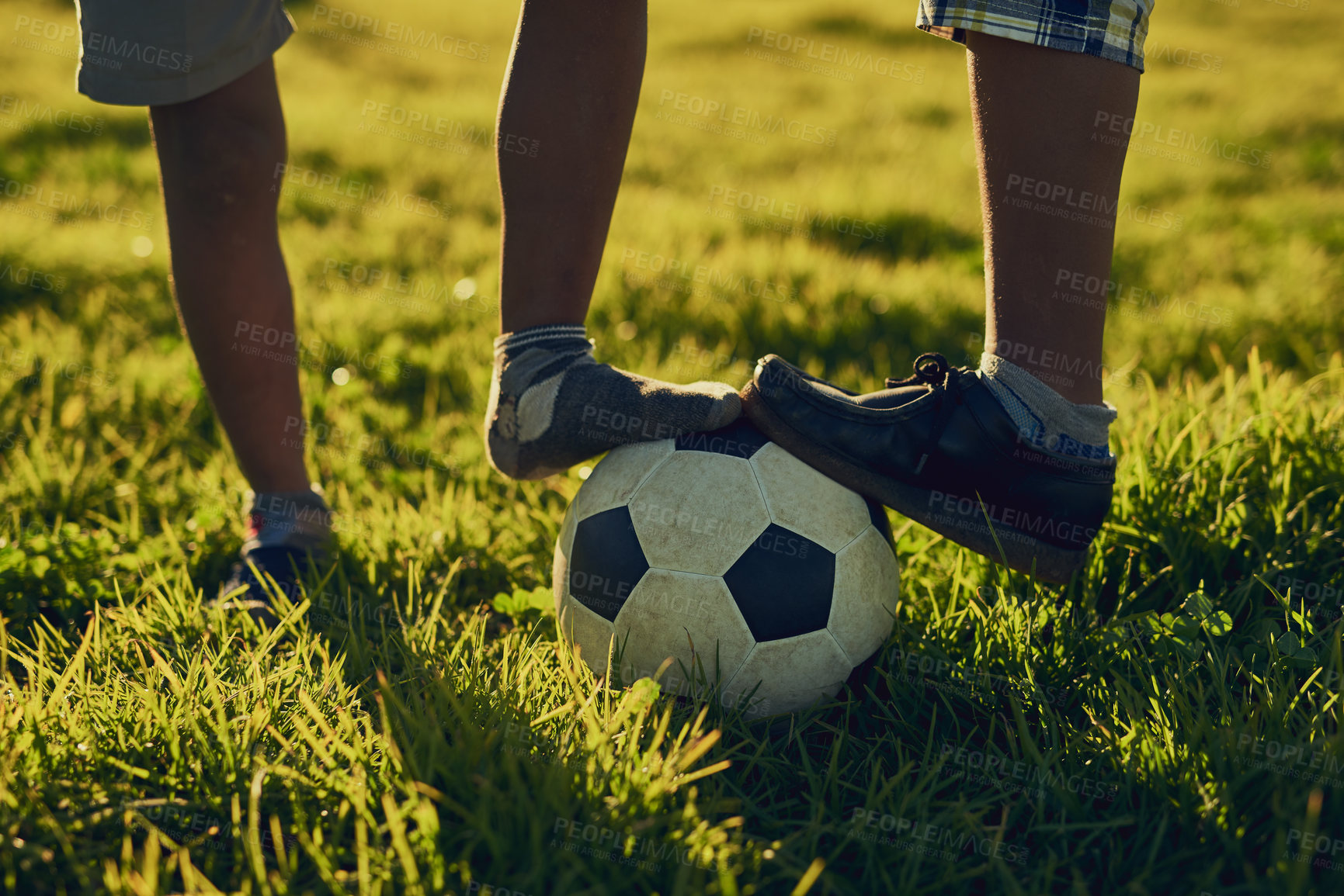 Buy stock photo People, legs and soccer ball in grass for sports or football match, game and tournament. Outdoor, team mates and training with practice, preparation and fitness for competition with teamwork or unity