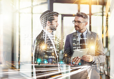 Buy stock photo Multiple exposure shot of two businessman talking together  with a digital tablet superimposed over a cityscape