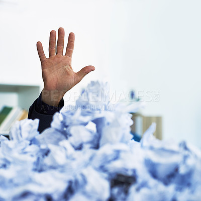 Buy stock photo Shot of an office worker's hand stacking out of crumpled up paperwork