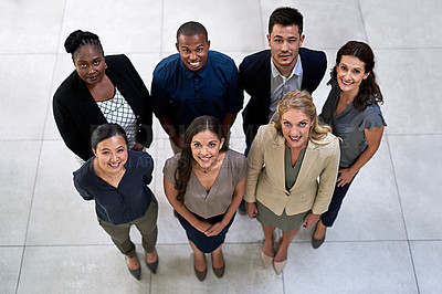 Buy stock photo High angle portrait of a team of businesspeople posing together in their office