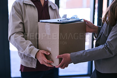 Buy stock photo Cropped shot of a courier making a delivery to a businesswoman at work
