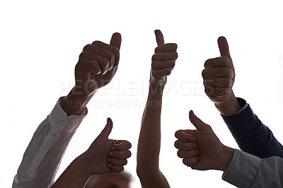 Buy stock photo Cropped shot of a group of people showing thumbs up against a white background